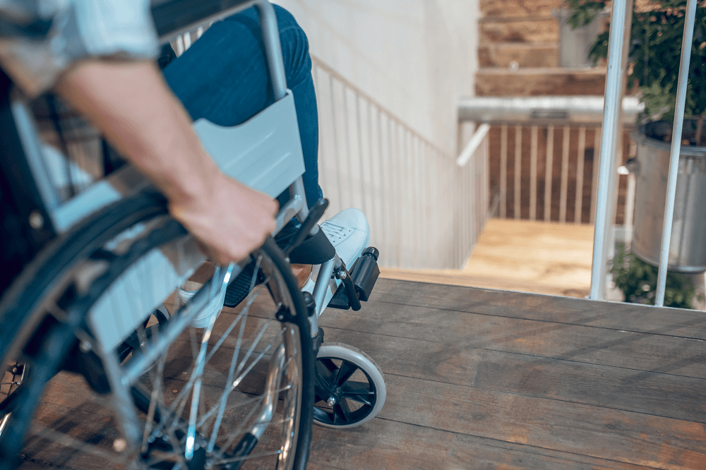 Man in Wheelchair near Stairs