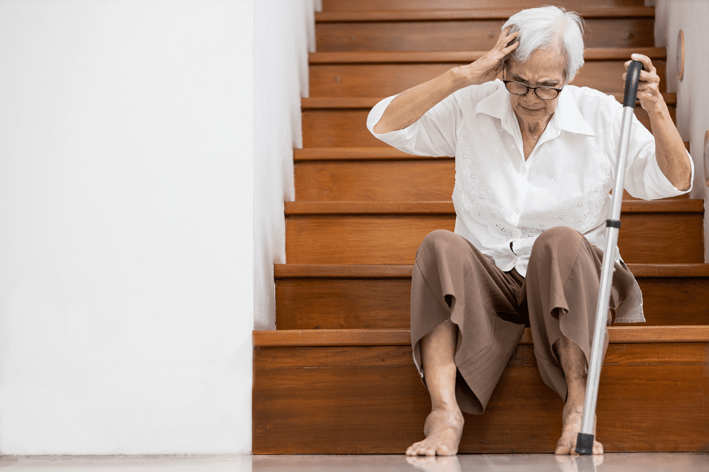 Elderly Woman at Bottom of Stairs